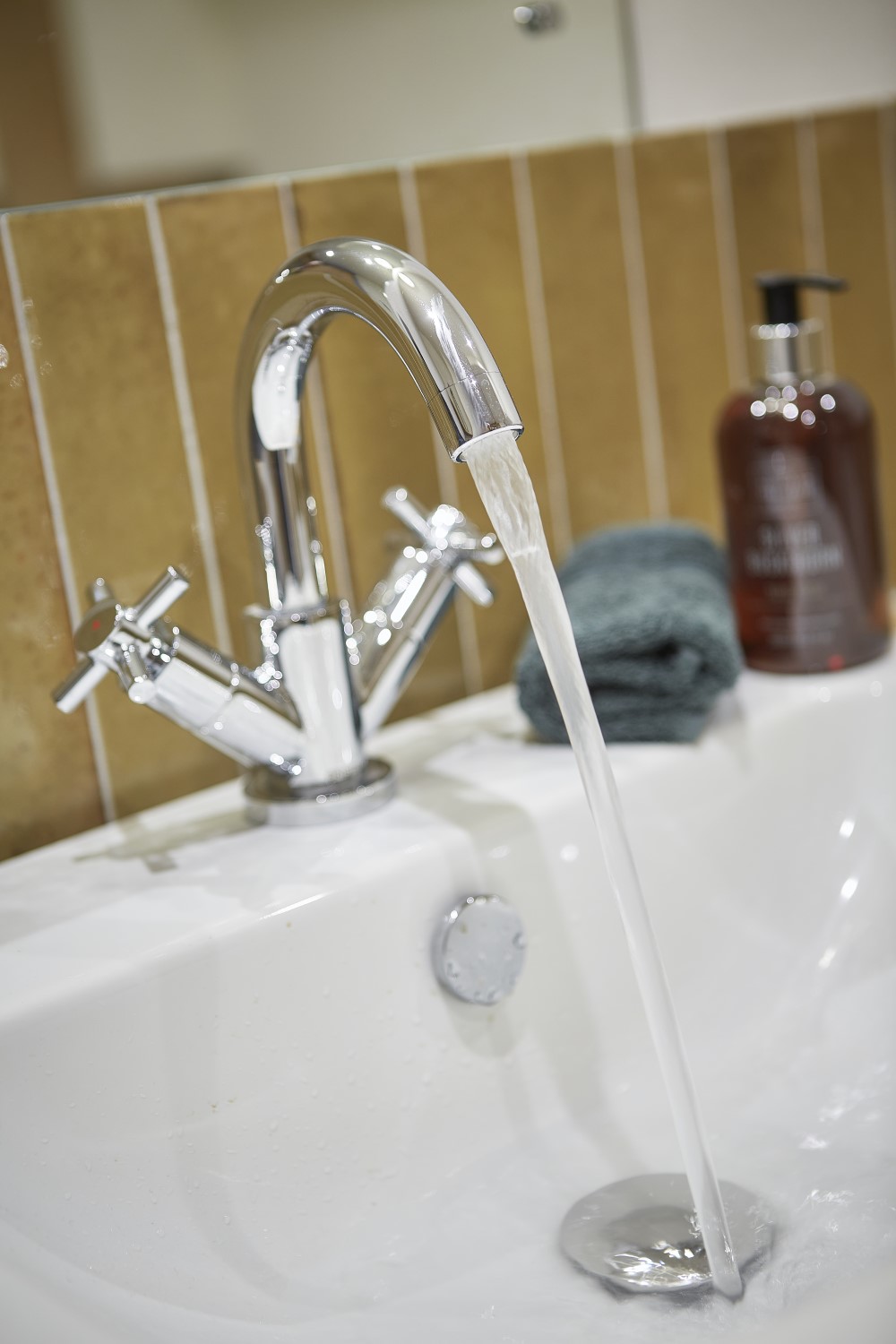 A running tap in the bathroom that is ensuite to the second bedroom